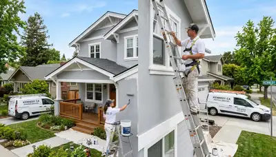 Professional house painters working on residential exterior in Stockton, CA