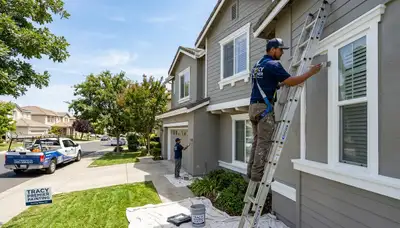 Professional house painters working on residential exterior in Stockton, CA